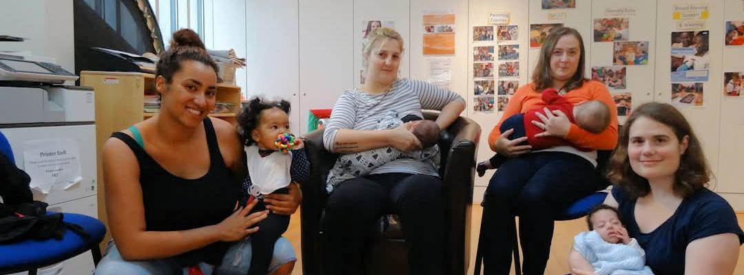 Two women holding babies and two women sitting and breast feeding babies Two women holding babies and two women sitting and breast feeding babies